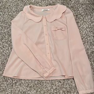 Dressy blouse. Cute details in the front. Used once